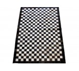 Cowhide Rug Patchwork Textured With Small Holes. Black And White 